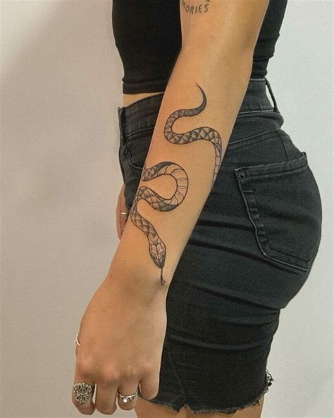 snake wrapped around arm tattoo|16 Snake Tattoos Wrapped Around Arm Inspiration